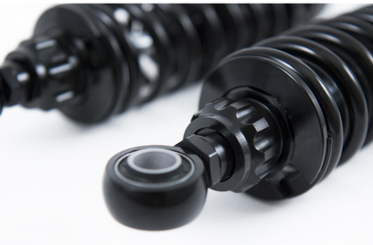 Close-up of black mechanical components on a white background