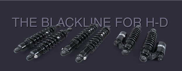 Motorcycle shock absorbers with 'The Blackline for H-D' text on a dark background