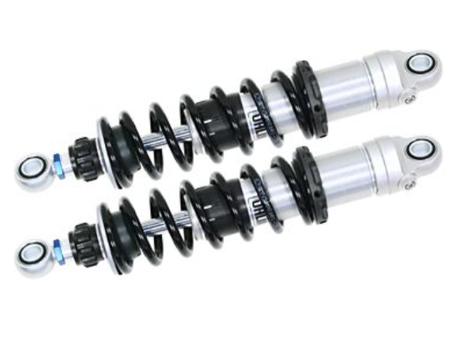 Two motorcycle shock absorbers on a white background