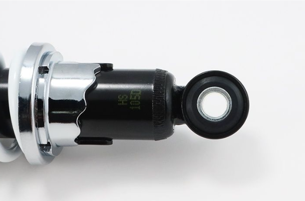 Close-up of a mechanical component with chrome finish on a white background