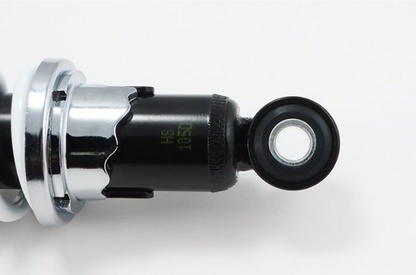 Close-up of a mechanical component with chrome finish on a white background