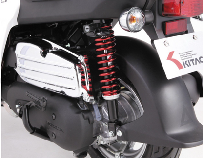 Close-up of a motorcycle suspension system with Kitaci branding.