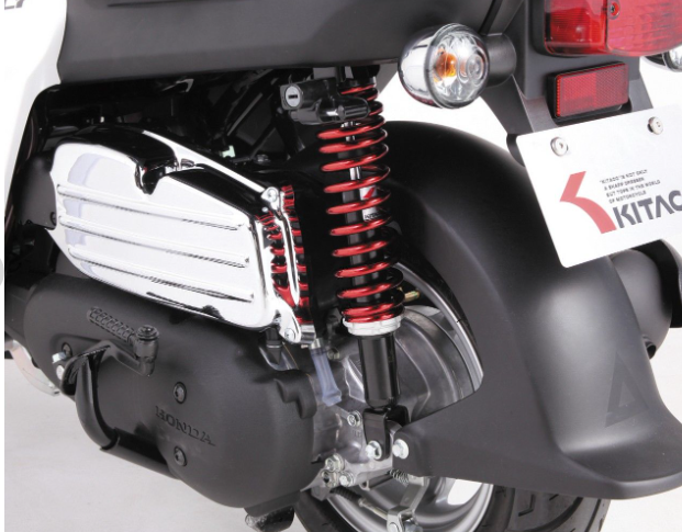 Close-up of a motorcycle suspension system with Kitaci branding.