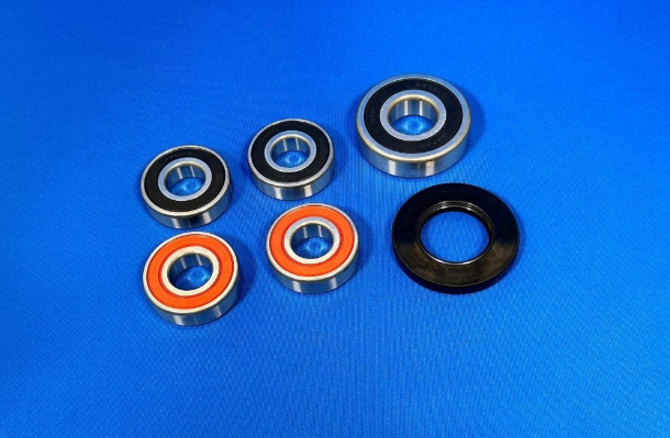 Set of bearings and seals on a blue background