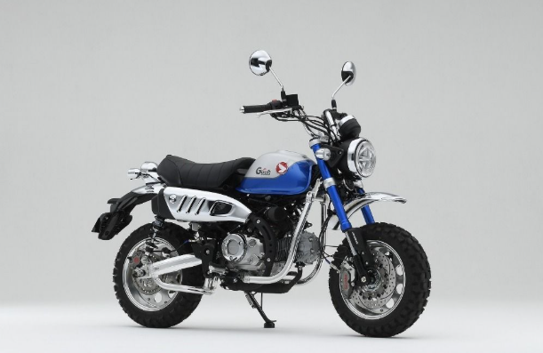 Blue and black motorcycle on a white background