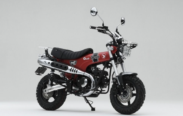 Red and black motorcycle on a gray background