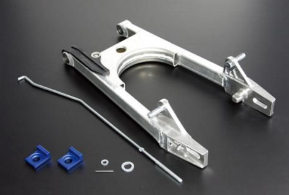 Metal mechanical component with blue connectors on a dark background