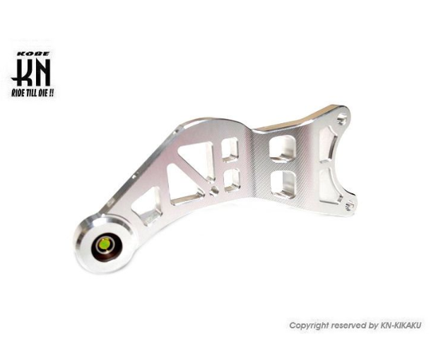 Metallic suspension link with KBR logo on a white background