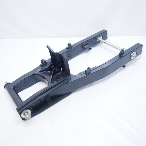 Metal vehicle suspension component on a white background
