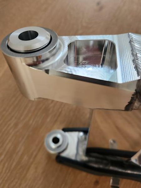 Metallic component on a wooden surface