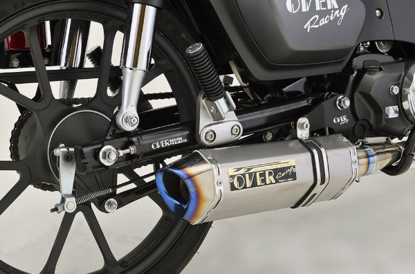 Motorcycle exhaust system with 'OVER Racing' branding on a white background