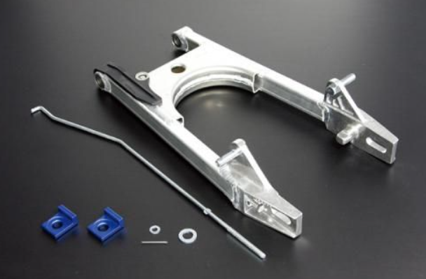 Metal suspension arm with blue components on a dark background