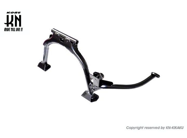 Black metal foot pegs on a white background with 'Kobe' branding.