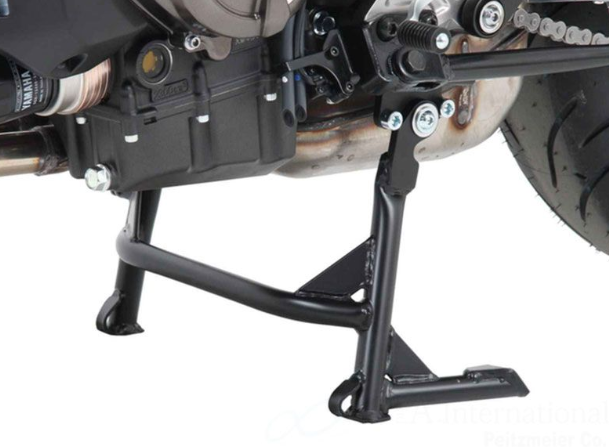 Close-up of a motorcycle stand on a white background