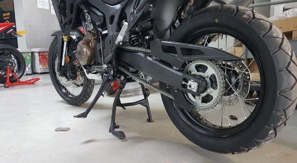Motorcycle on a stand in a garage setting