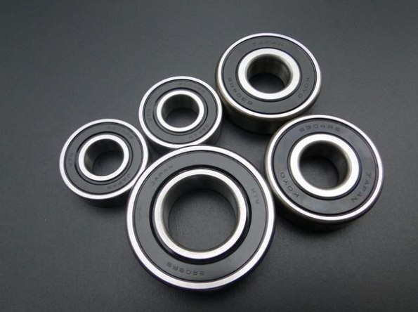 Six bearings arranged on a dark gray background