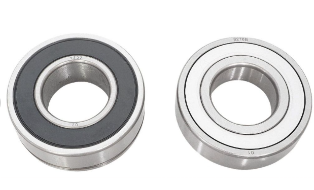 Two metal bearings on a white background
