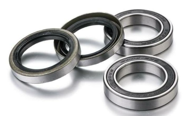 Four metal bearings on a white background