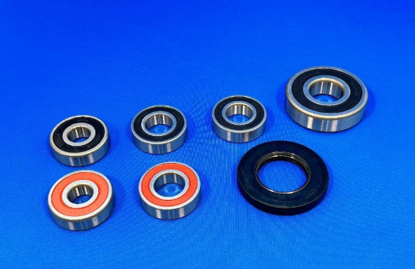 Set of bearings and seals on a blue background