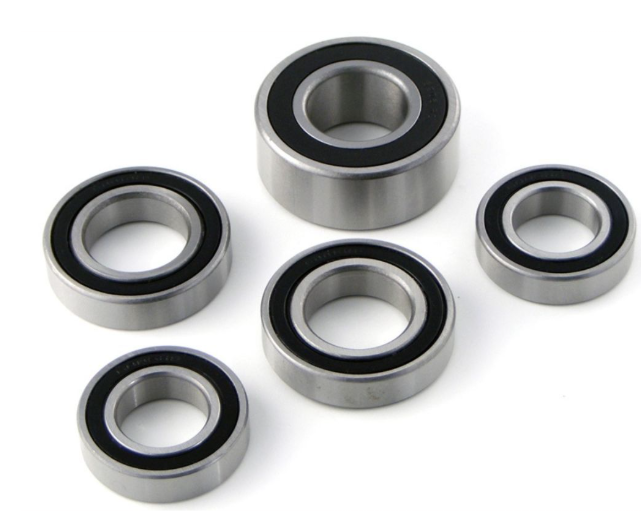 Set of five metal bearings on a white background