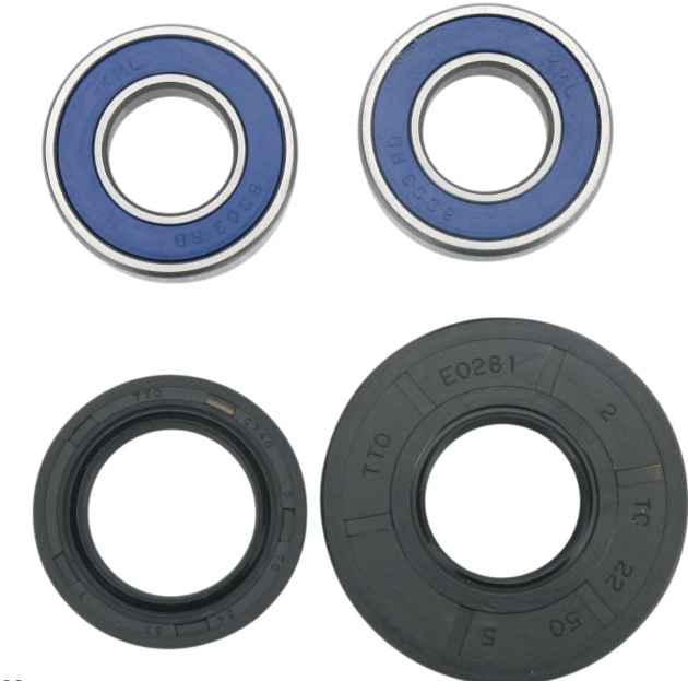 Two pairs of bearings and two seals on a white background