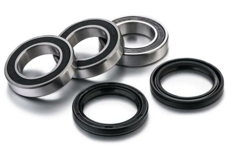 Set of metal bearings and seals on a white background