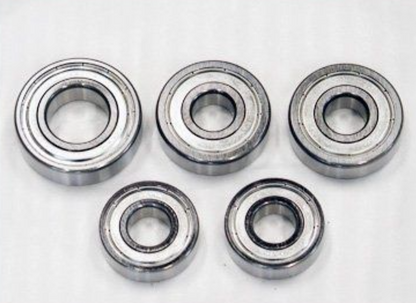 Five metal bearings on a white background