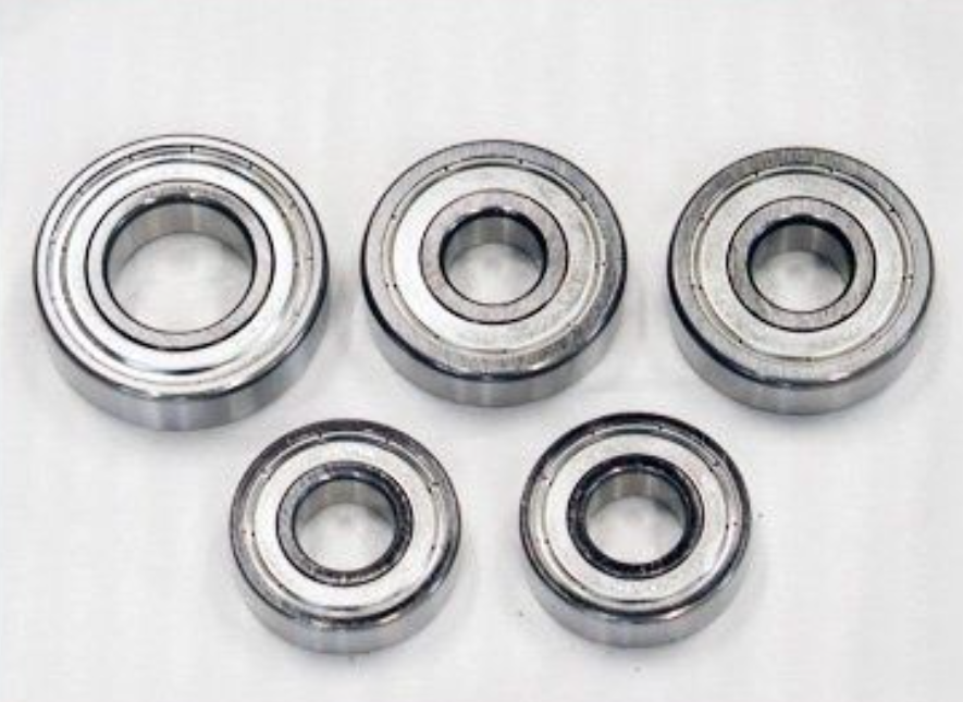 Five metal bearings on a white background