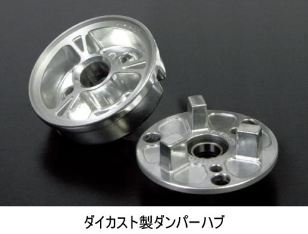 Two metallic wheel hub components on a black background