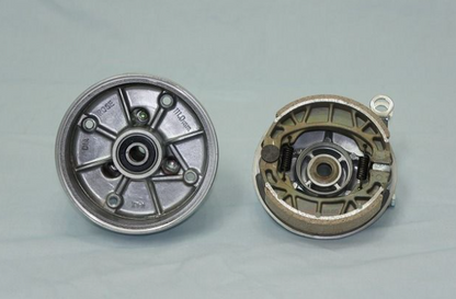 Two mechanical components on a gray background