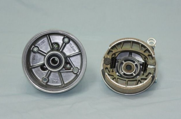 Two mechanical components on a gray background