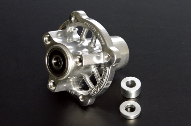 Metallic hub with two washers on a black background