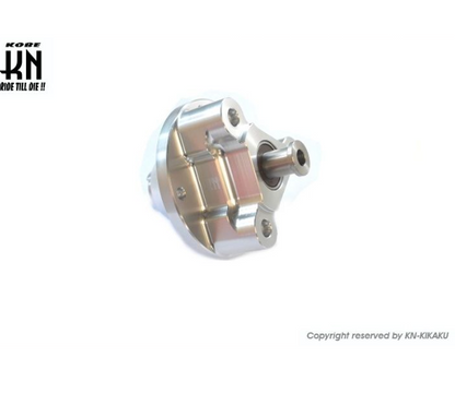 Metal mechanical component with KON-KIKAKU branding on a white background