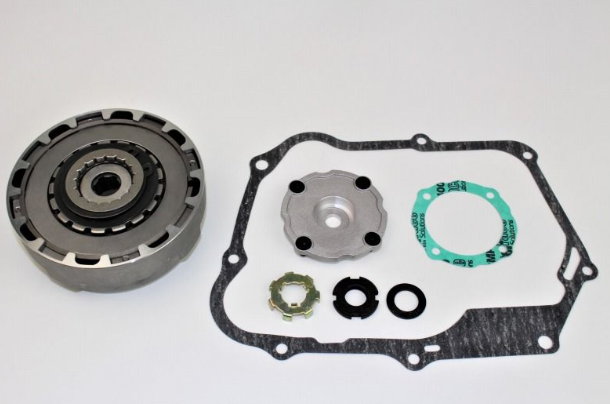 Mechanical parts including a clutch plate, gaskets, and washers on a white background