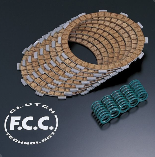 Clutch plate set with springs on a dark background, featuring F.C.C. Clutch Technology logo.