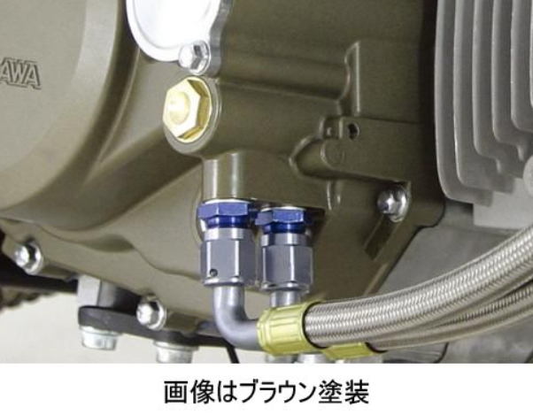 Close-up of mechanical components with hoses and connectors on a brown background