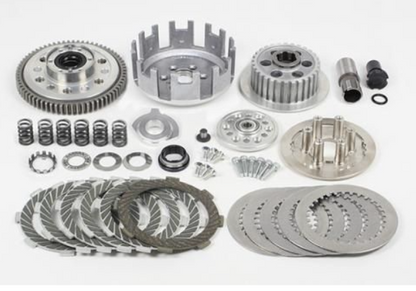Collection of metal clutch components on a white background