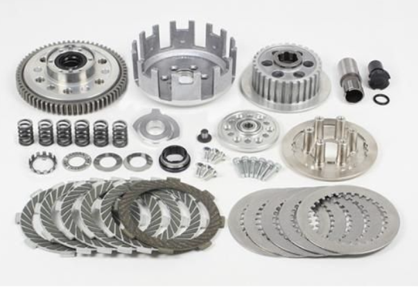 Collection of metal clutch components on a white background