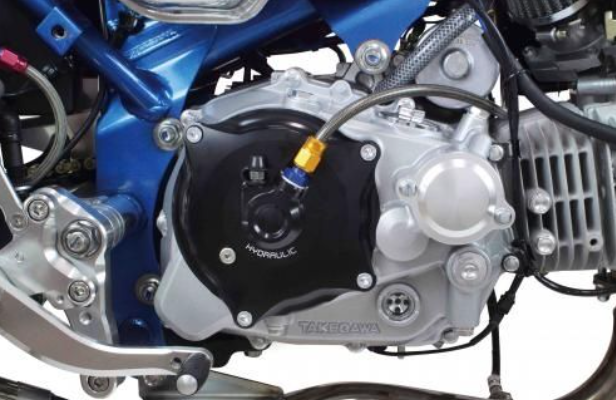 Close-up of a motorcycle engine with visible branding