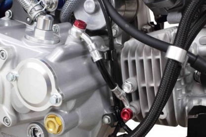 Close-up of a motorcycle engine with visible components and wiring.