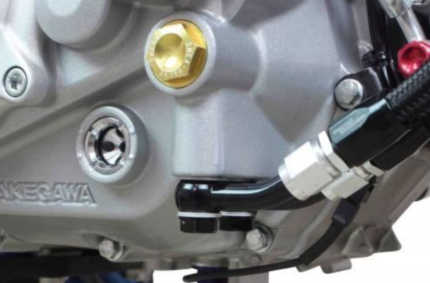 Close-up of a motorcycle engine with 'Nakagawa' branding.