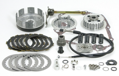 Mechanical parts including gears, springs, and clutch plates on a white background