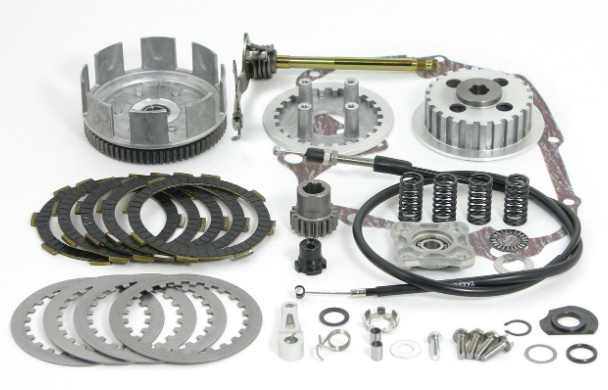 Mechanical parts including gears, springs, and clutch plates on a white background