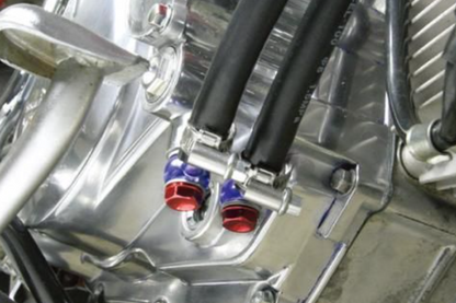 Close-up of a mechanical engine component with metallic and black parts.