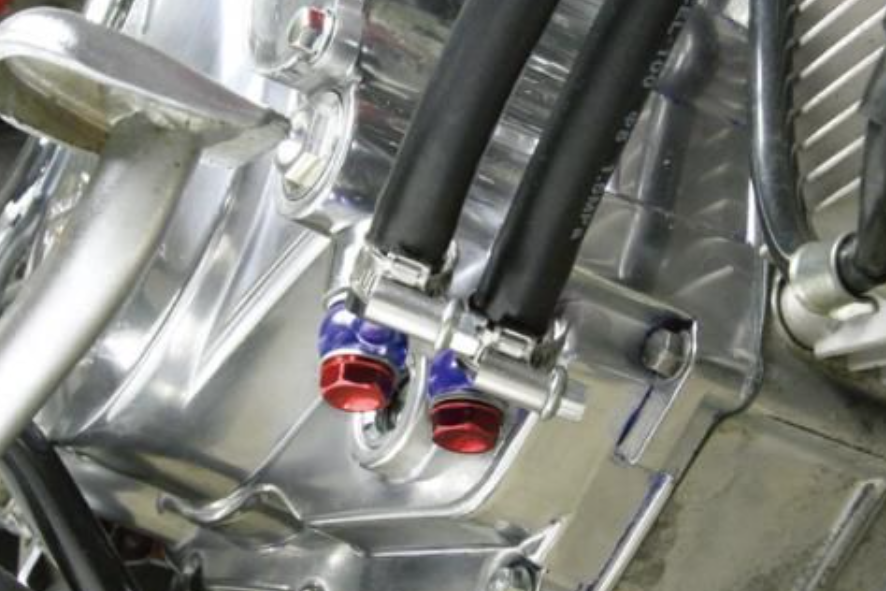 Close-up of a mechanical engine component with metallic and black parts.