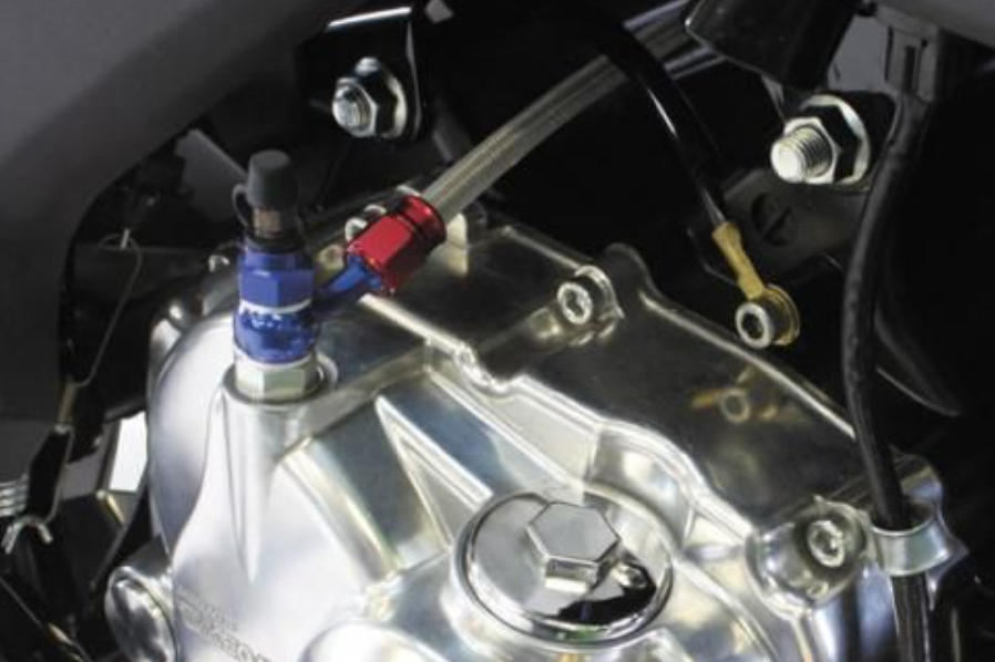 Close-up of a mechanical component with visible branding on a vehicle.