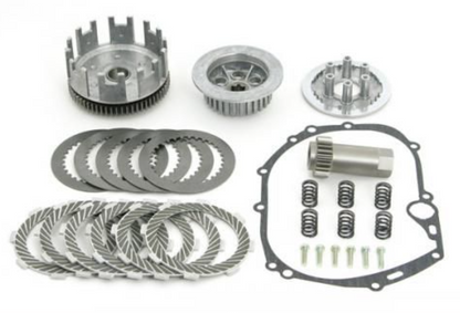 Collection of mechanical components including gears and springs on a white background