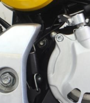 Close-up of a motorcycle's engine and exhaust system.