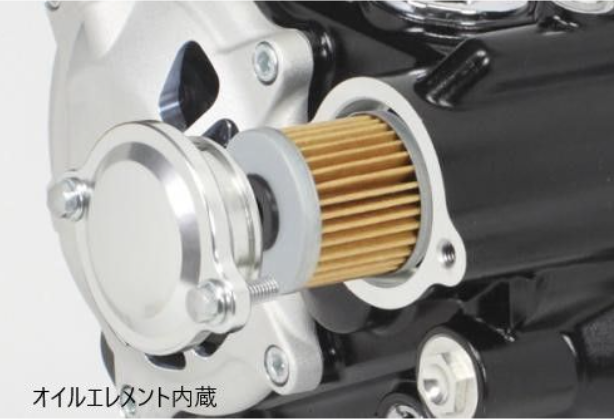 Close-up of a motorcycle oil filter with metallic and black components.