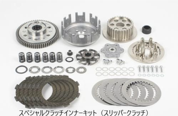 Collection of metal gears and clutch components on a white background